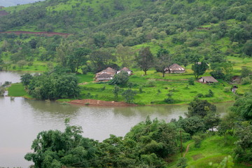 Fototapeta na wymiar Village on the back waters of a Dam (Panshet, Pune, Maharashtra, India)