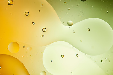 Beautiful green and orange color abstract background from mixed water and oil