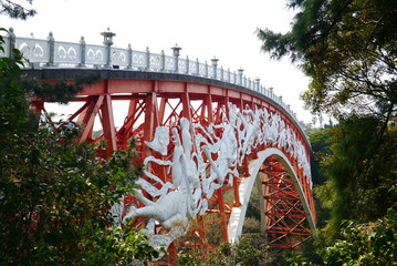 horizontal view on the landmark Seonim Gyo Bridge over the Cheonjeyeon Waterfall on Jeju Island, South Korea, Asia