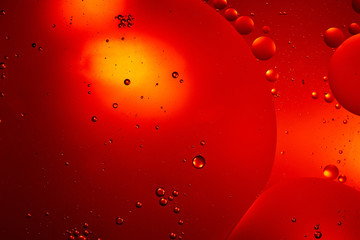 Beautiful red color abstract background from mixed water and oil bubbles