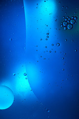 creative abstract blue color background from mixed water and oil