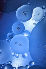 Beautiful abstract background from mixed water and oil in blue color