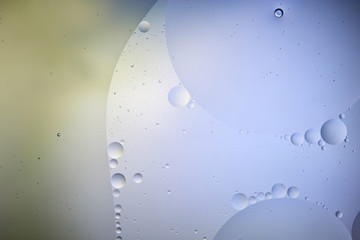 Beautiful abstract background from mixed water and oil in light blue and green color
