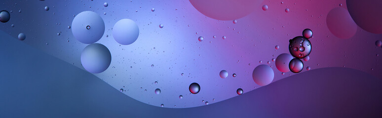 panoramic shot of blue and purple color background from mixed water and oil