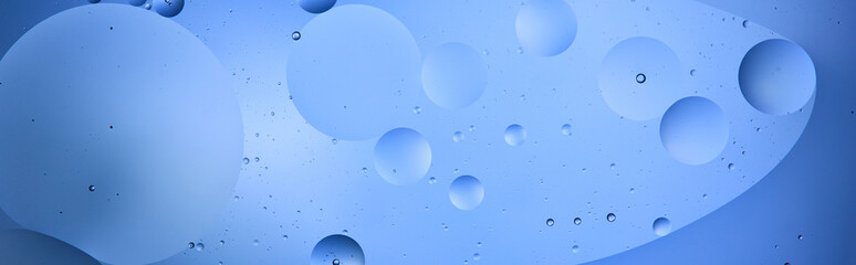 panoramic shot of Beautiful color abstract background from mixed water and oil in blue color
