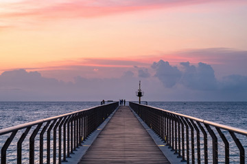 Fototapeta premium Sunrise in a mediterranean harbor. Pont del Petroli, Badalona, Barcelona, Catalonia, Spain