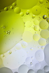 abstract green and grey color background from mixed water and oil bubbles