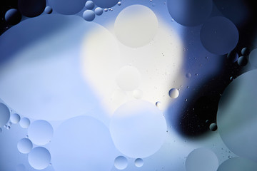 light blue color abstract background from mixed water and oil