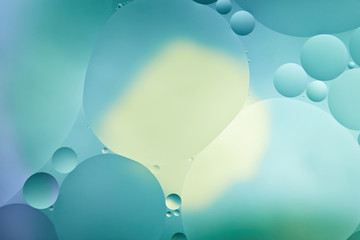 creative abstract turquoise color background from mixed water and oil