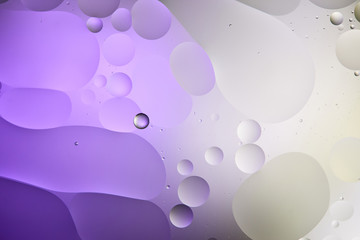 abstract purple and grey color texture from mixed water and oil bubbles