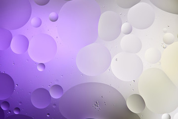 abstract purple and grey color texture from mixed water and oil bubbles