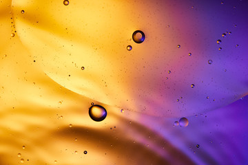 abstract orange and purple color background from mixed water and oil
