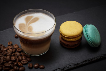 Coffee cappuccino and coffee beans on black background