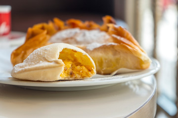 Delicious portuguese traditional pastry from Coimbra on white plate