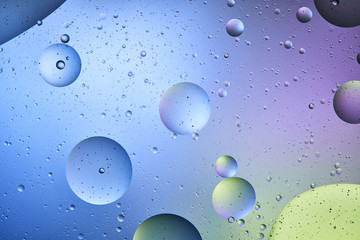 blue, purple and green color abstract background from mixed water and oil