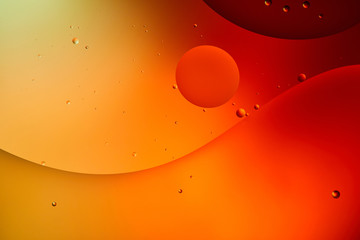 abstract orange and red color background from mixed water and oil