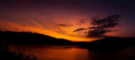 Fototapeta na wymiar Sunset over a lonley lake near Siegen