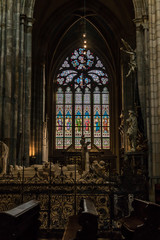 Fototapeta na wymiar Prague, Czech Republic: Colorful religious stained glass window inside St. Vitus Cathedral