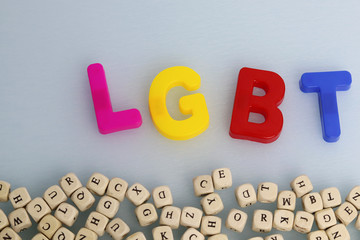 Naklejka premium LGBT community symbol on a white background and red heart. Human rights, equality. Sign for lesbians, gays, bisexuals and transgender people. LGBT concept. Copyspace for text.