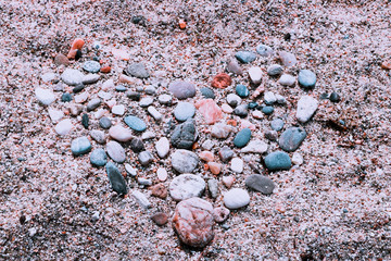 Abstract illustration of a heart made of stones at the sand.