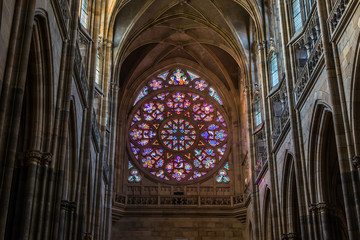 Prague, Czech Republic: Colorful religious stained glass window inside St. Vitus Cathedral