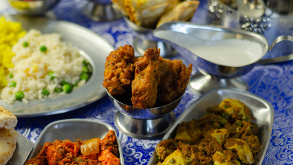 Chicken jalfrezi and chicken curry with various rice and onion Bhajis and Samosas
