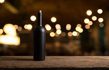 Wine tasting experience in the rustic cellar and wine bar: red wine glass and collection of...