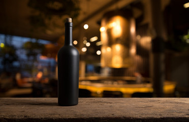 Wine tasting experience in the rustic cellar and wine bar: red wine glass and collection of...