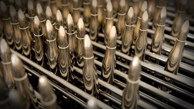 Cartridge arms on conveyor line. Production process of pistol's cartridges. Building combat potential. Preparing for a military operation. Peace enforcement