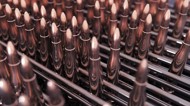 Production process of pistol's cartridges. Cartridge arms on conveyor line. Building combat potential. Preparing for a military operation. Peace enforcement
