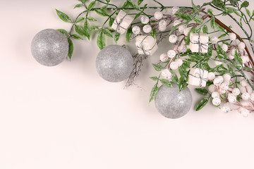 White christmas background. White Christmas tree toys. Decorative branch with berries. Top view.