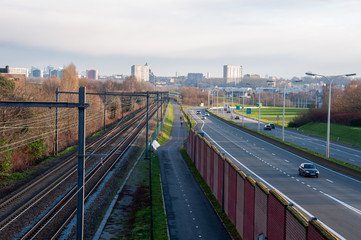 Fototapeta na wymiar Cycling highway in Brussels in between a railroad and a motorway, Belgium