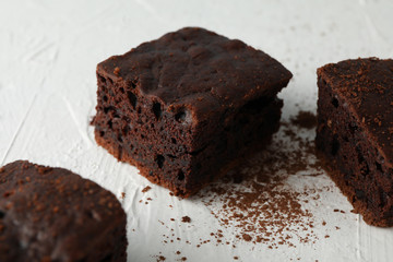 Chocolate cake slices on white background, close up