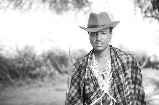 handsome maasai warrior in a cowboy hat
