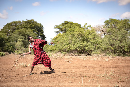 Handsome Maasai Warrior Throwing His Spear