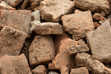 A large pile of stones color Orange,background Stone pile construction