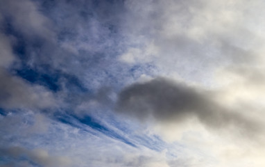 Beautiful white and orange cloud formations on an autumn sky
