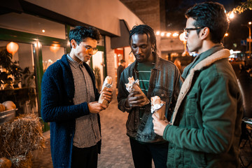 Young guys standing together in the city