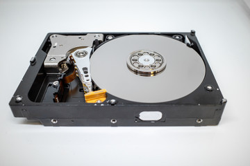 a screwed-on hard disk shows the inner workings of a hard disk