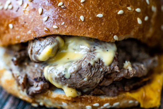 Steak Burger made with Lamb Meat Lokum and Cheddar Cheese / Hamburger or Cheeseburger on Wooden Surface.