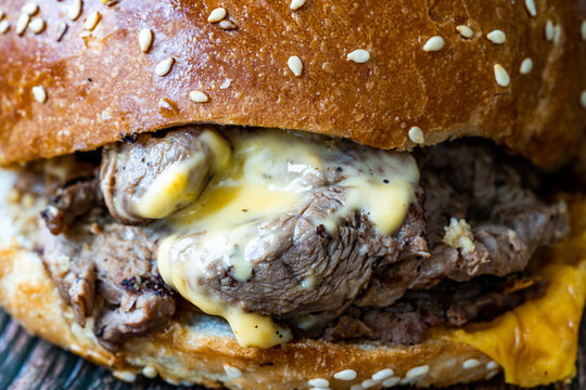 Steak Burger made with Lamb Meat Lokum and Cheddar Cheese / Hamburger or Cheeseburger on Wooden Surface.