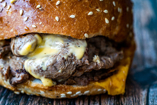 Steak Burger made with Lamb Meat Lokum and Cheddar Cheese / Hamburger or Cheeseburger on Wooden Surface.