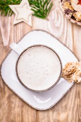 White cup of coffee cappuccino and homemade cookies, top view