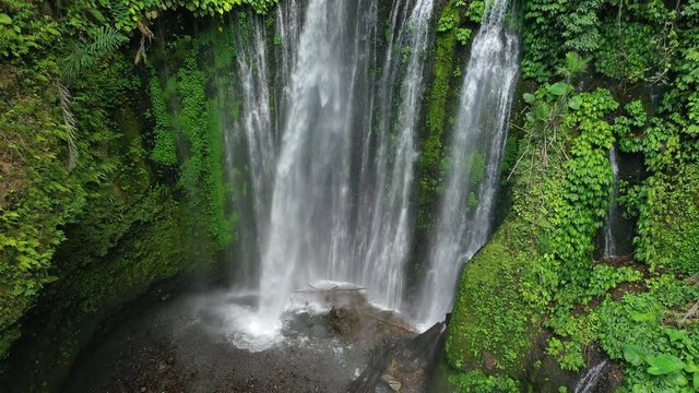 Aerial tripod, Tiu Kelep waterfall with stunning foliage in Indonesia.