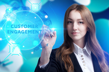 Business, Technology, Internet and network concept. Young businessman working on a virtual screen of the future and sees the inscription: Customer engagement
