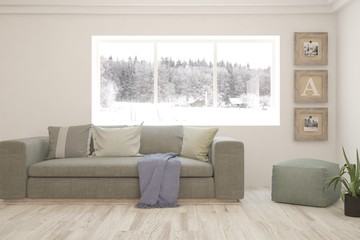 Stylish room in white color with sofa, frames on a wall and winter landscape in window. Scandinavian interior design. 3D illustration
