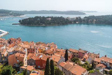 Fototapeta na wymiar The view of Rovinj, Croatia, from the very top of the Baroque Church of St. Euphemia, Rovinj. The relics of Saint Euphemia are preserved in a Roman sarcophagus from the sixth century.