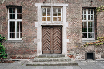 Fototapeta na wymiar Old wooden door. Old door in a modern building
