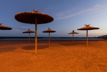 Long exposure night photo of beach umbrellas