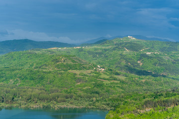 Fototapeta na wymiar landscape with the Butoniga lake and mountains in Istria, near Motovun, Croatia, Europe. Distant rural villages and cities